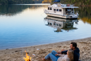 A Campfire on the beach watching the sun setting